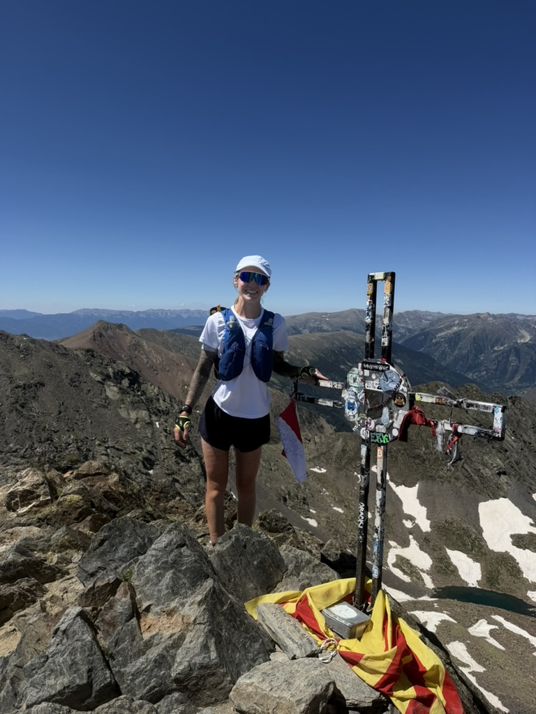 Sara Eydmann at the top of a mountain